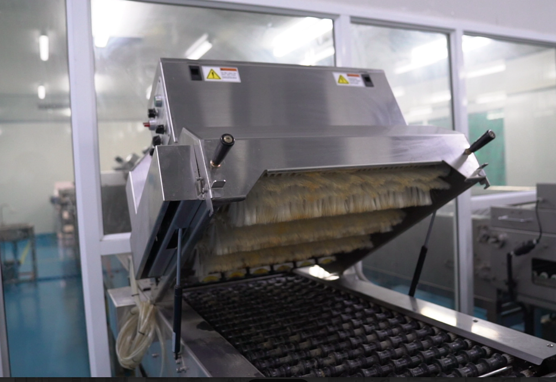 A Factory Machine Efficiently Preparing Food Items As Part Of The Production Line