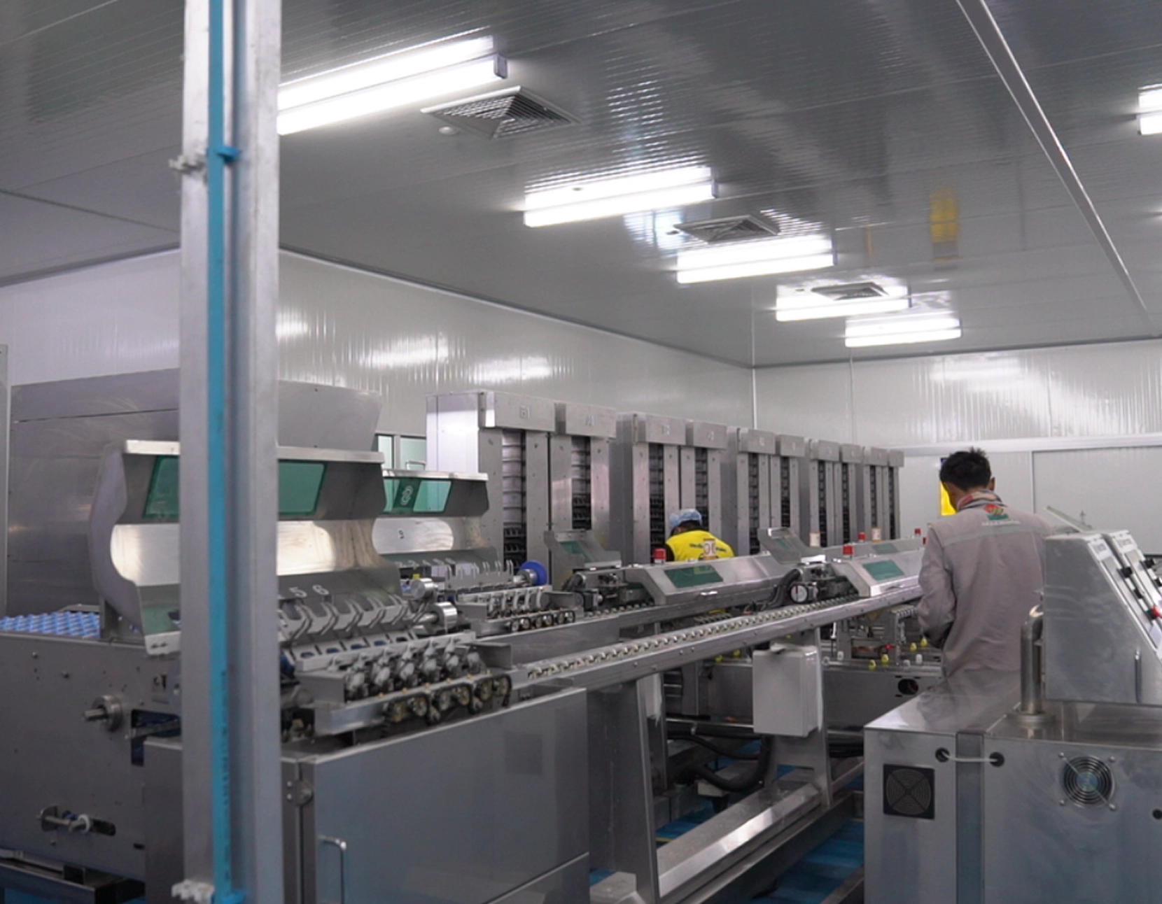 A Man Operates Machinery In A Factory
